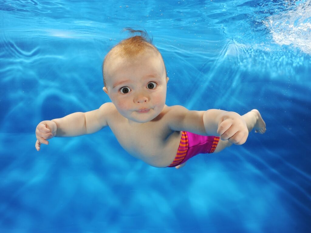 mila pickett at a water babies underwater photoshoot
