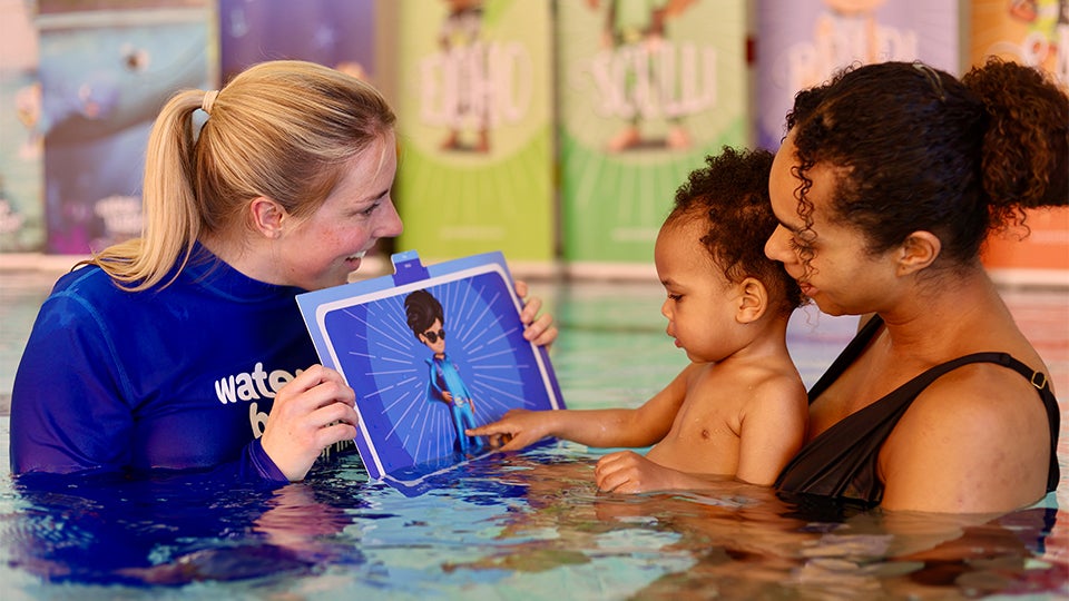 water babies teacher with swimcard, baby and carer