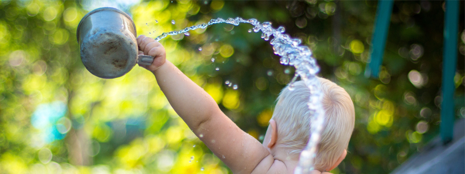 baby splashing in water