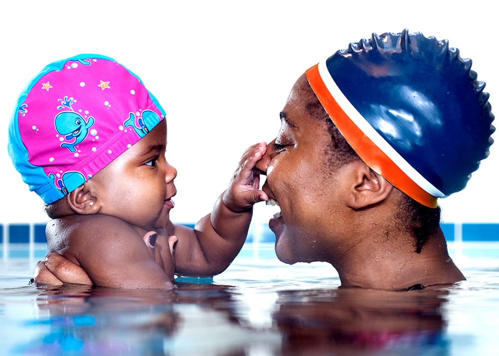 mother and daughter in the pool at water babies lessons