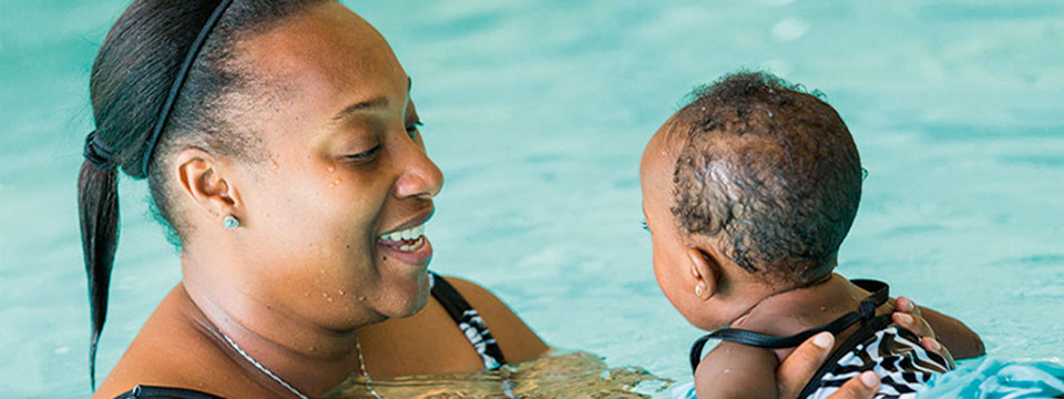mother and daughter swimming