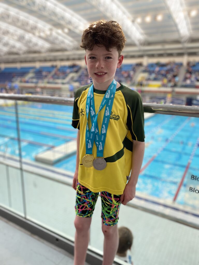 leo west-hurst with swimming medals