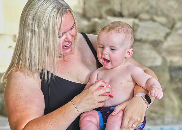 a-water-baby-being-held-by-mother