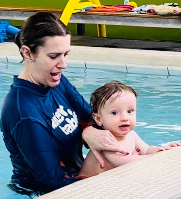 water babies teacher laura with baby in lessons