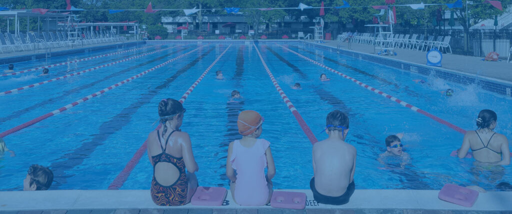 3 children sat on poolside